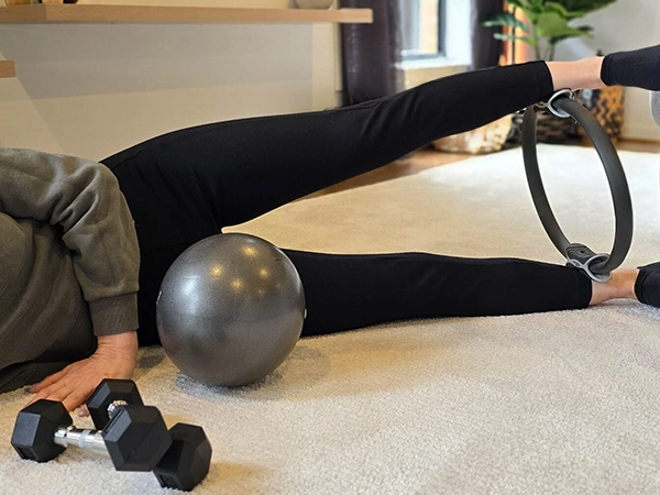 NDIS-approved home physio session with core ball, dumbbells, and pilates ring in Melbourne