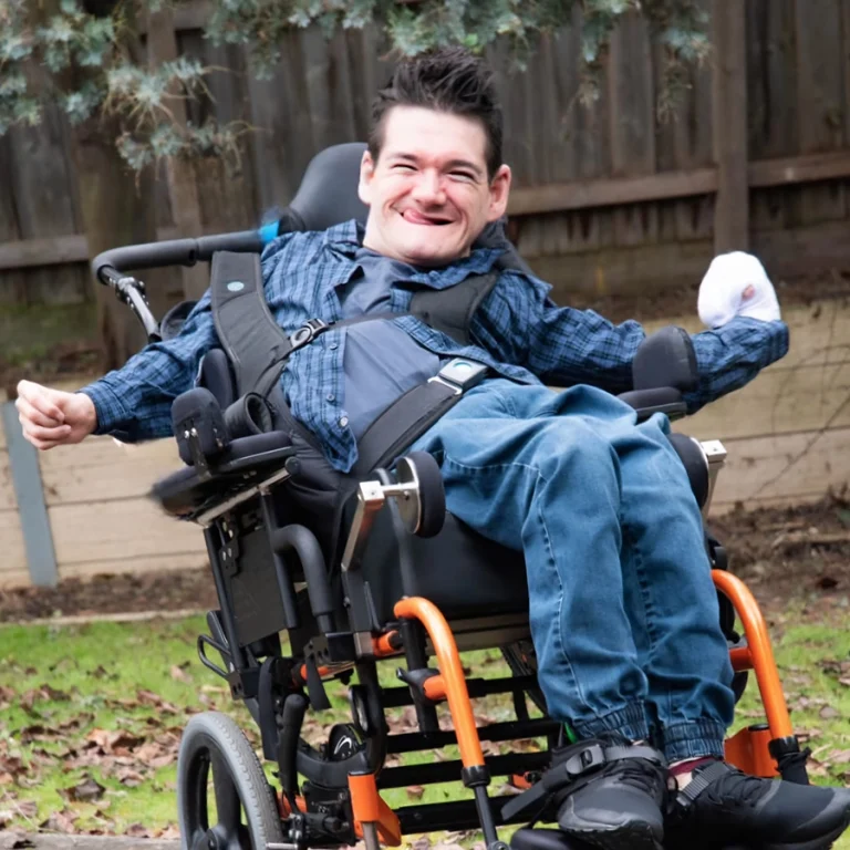 NDIS participant in wheelchair outdoors in Melbourne
