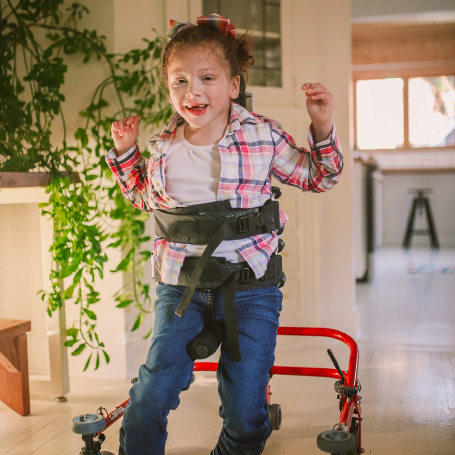 NDIS-supported child using pediatric walker for independence and physical development in Melbourne